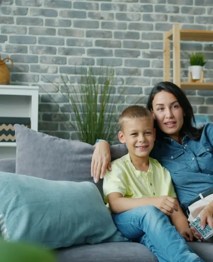 Support team meeting with an adoptive family around a table