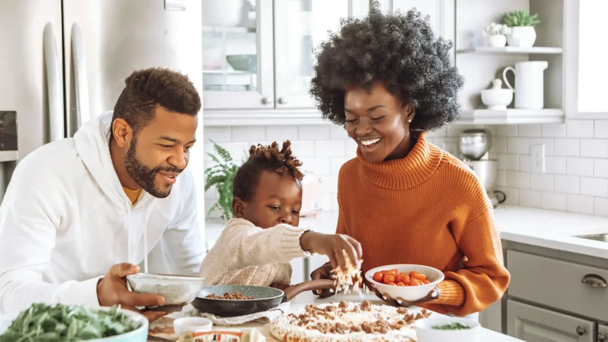 Support team meeting with an adoptive family around a table